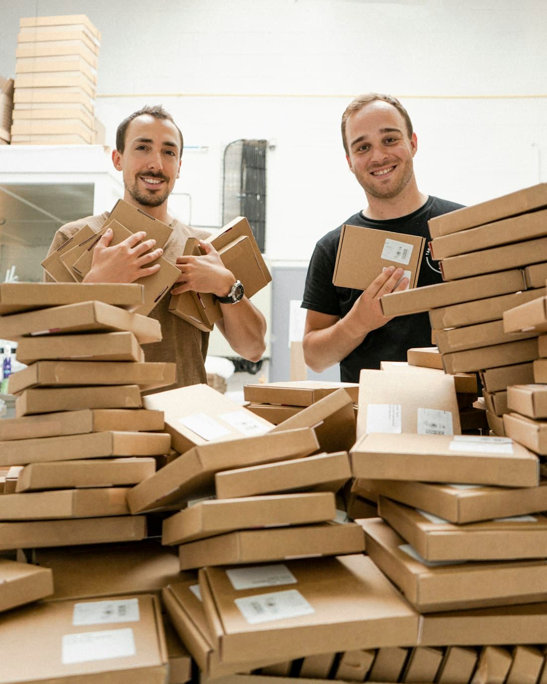E-commerce founders with packaged orders ready to ship